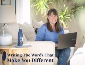 Rebecca Chamberlain seated on a sofa with laptop and legend Writing the Words that Make you Different